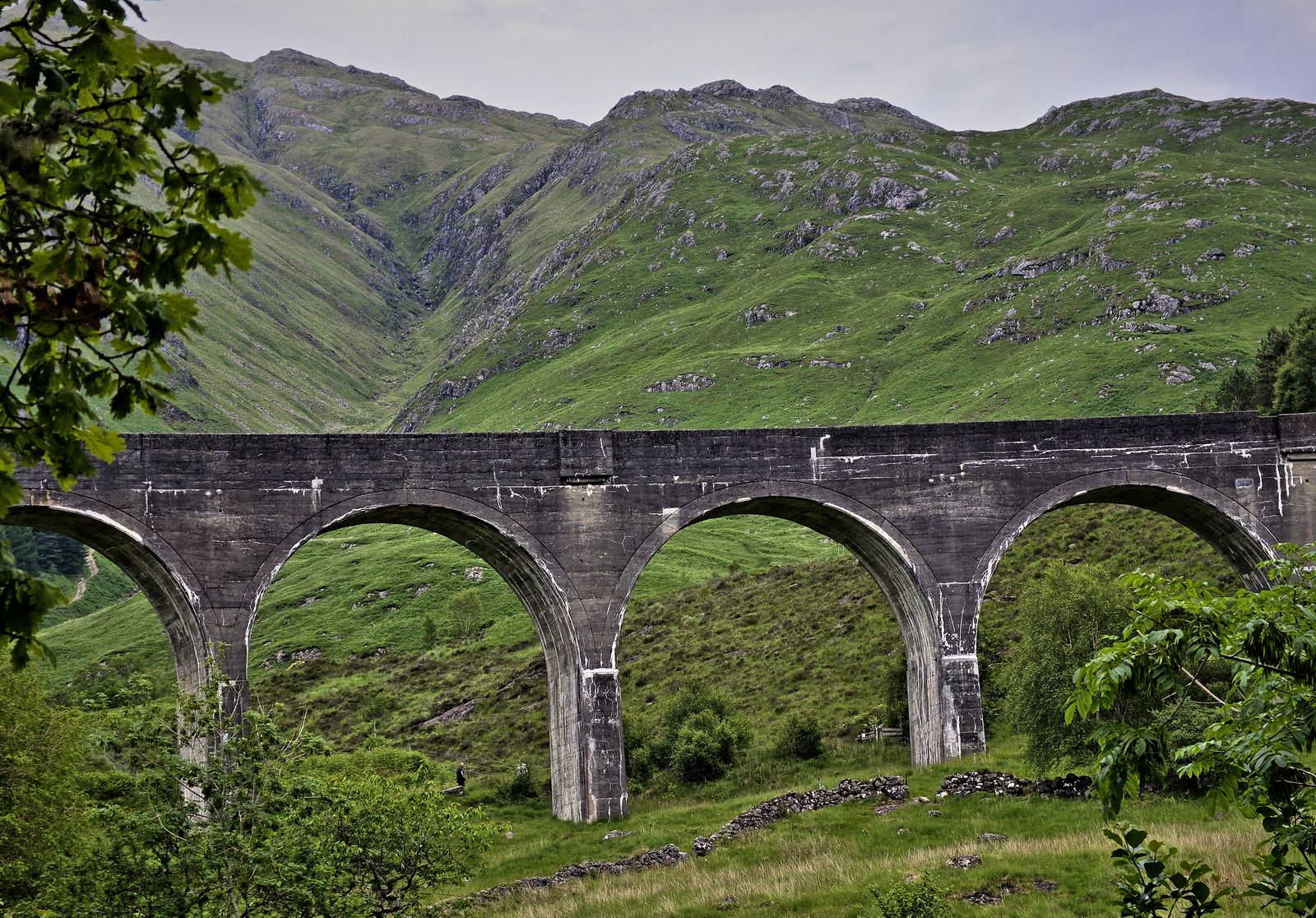 Glenfinnan Viaduct with green mountains behind